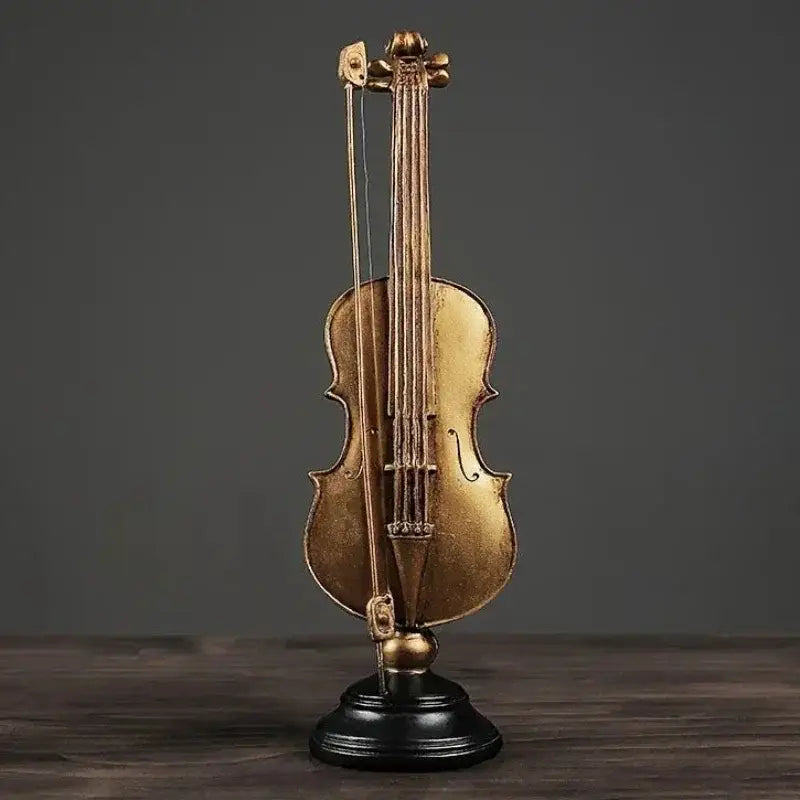Figurinas Douradas de Violino e Saxofone para Decoração Elegante Compre agora Ricaly